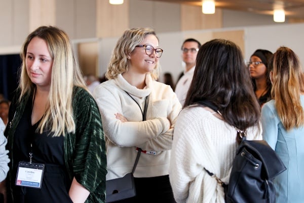 Students talking in a group.